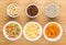 Ingredients for muesli in bowls on bamboo table