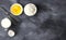 Ingredients for pastries: flour, eggs, milk against a dark background