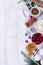 Ingredients for the preparation of homemade Christmas baking cranberries, flour, cinnamon, eggs and seasoning anise on a light