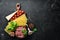 Ingredients for the preparation of Lasagna. Tomatoes, sauce, pasta. On a black background. Top view.