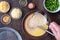 Ingredients for quinoa egg bake, raw egg mix in glass bowl with metal whisk, quinoa, cheese, herbs, broccoli, glass baking dish, o