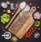 Ingredients for risotto, rice, salt, pepper, tomatoes, ham, butter, cheese and grater on wooden rustic background top view close u