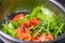 Ingredients of salad with red fish, tomato and greens