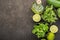 Ingredients for salad: rucola, root salad, olive oil, limes on a dark background. Seasonal Healthy Eating.