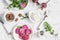 Ingredients for salad or snack - beets, arugula, goat cheese, walnuts on a white background.