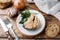 Ingredients for salmon fish soup, pieces of bread, onion and garlic with greens on wooden background