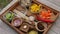 Ingredients served on tray ready to cook vegetable sauce from carrots, cashew nuts, yellow bell pepper, miso paste