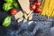 Ingredients for spaghetti with tomato sauce: basil, tomatoes,parmesan on blue wooden background , top view