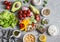 Ingredients for spring vegetable buddha bowl. Delicious healthy food. On a gray background