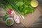 Ingredients on the table - raddish, lettuce, onion, oil and oregano