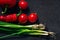 Ingredients for tasty eat making: tomatoes, onion. pepper on dark background, top view, border