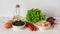 Ingredients for tasty tuna salad: canned tuna meat, fresh lettuce, boiled eggs, cherry tomatoes on the vine, black olives, red