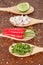 Ingredients of thai food on wooden spoon (chili, pepper, garlic