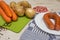 Ingredients to make typical dutch hutspot, with carrot, onion, s