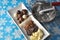 Ingredients and tools for making chocolates on winter background with snow flakes