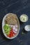 Ingredients for whole wheat toasts with cheese, radish, cucumber, cherry tomatoes