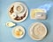 Ingredients for yeast fermented dough. In white porcelain utensils the layout on a blue background