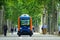 The inhabitants of the city of Toulouse, walk next to a mini electric bus autonomous, on the esplanade Alain Savay. This transport