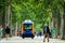 The inhabitants of the city of Toulouse, walk next to a mini electric bus autonomous, on the esplanade Alain Savay. This transport