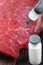 Injection of antibiotic into raw meat.