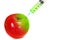 Injection green into red fresh wet apple with syringe on white background for renew energy , therapy or refresh or boost up energy