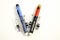 Injection pens and cartridge on a white background.