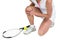 Injured athlete with tennis racket and tennis ball