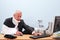 Injured businessman working at his desk