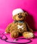 Injured child`s teddy bear with a belly and head