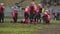 Injured football player lying on field, suffering pain, waiting for first aid