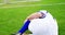 Injured football player lying on grass