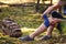 Injured hiker putting elastic bandage to her knee