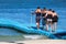 Injured tourist with crutch and friend supporting on the floating pier.Travel at tropical beach summer