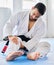 Injury, karate and man with knee pain after an accident in martial arts training in a wellness studio or dojo. Fitness