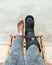 injury woman with black splint on leg sitting on wooden chair a