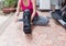 injury woman in sportswear with black splint on leg sitting on