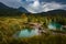 Ink Pots, Banff Alberta. Rain-kissed landscapes come alive in a dance of colors. Verdant meadows and crystal-clear pools blend