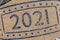 Ink stamp 2021 on piece of brown paper