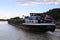 Inland freight water vessel Konrad Brand passes the lock Eckersmuehlen on the Rhine-Main-Danube Canal in Bavaria