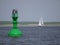 inland shipping regulation Green light buoy with solar panels as energy source , Blurred, background