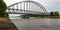 Inland transport vessel under a railroad bridge in the Netherlands