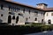 Inner courtyard of Castelvecchio with driveway and box hedge in Verona.