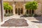 The inner courtyard of the Church of the Nativity is surrounded by beautiful covered terraces with stone columns, Bethlehem,