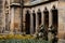 The inner courtyard inside medieval gothic Meissen cathedral Meissner Dom, stone arches and sculptures in the monastery garden