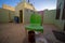 Inner courtyard in a Nubian guest house in Sudan with a view of the wash house in front of the breakfast table with coffee and