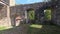 Inner courtyard of the ruins in Brennberg with old trees and walls