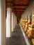 In the inner hallway of Wat Arun, there is a Buddha image on the side of the wall showing the Thai architecture assembly work.