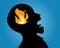 Inner problem mental health, silhouette of anger man screaming, flaming fire in head