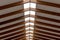 The inner roof consists of wooden beams and lets natural light through