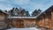 Inner village courtyard. The house, the fence - from natural unpainted logs